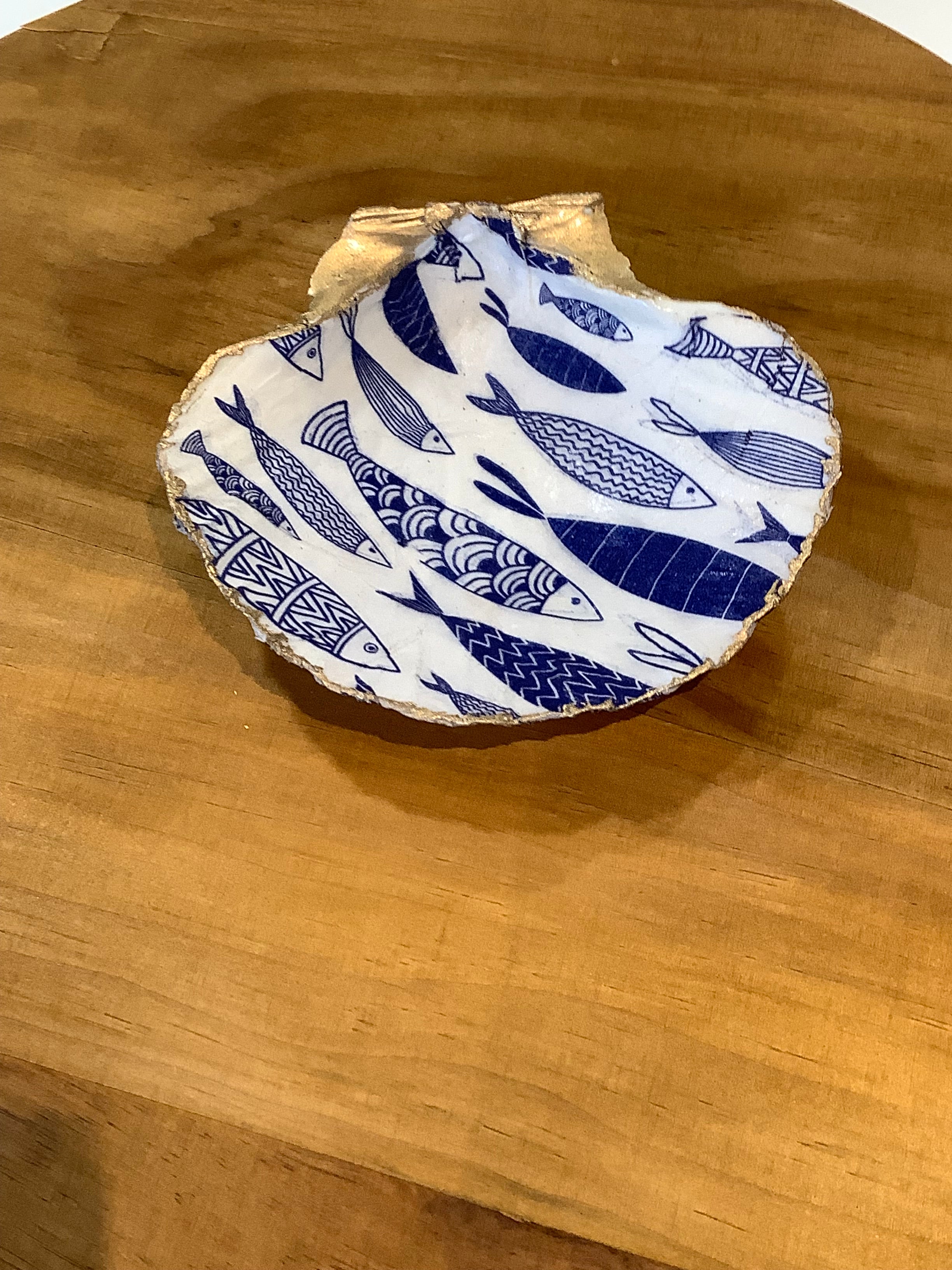 Hand-decorated scallop shell with light-hearted shoal of fish design, unique coastal art gift to use as a trinket tray