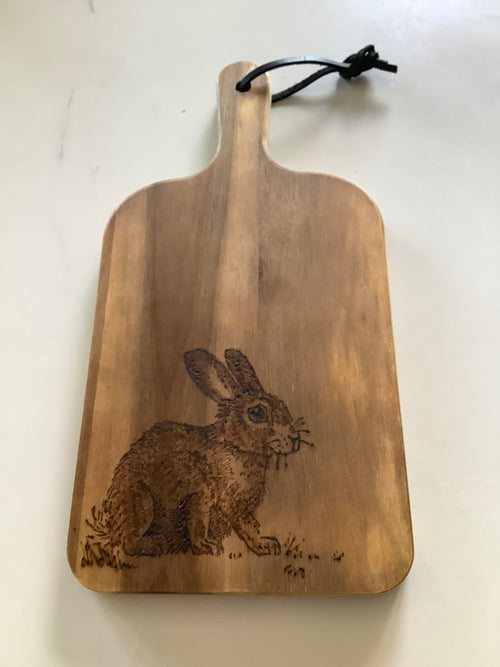 Hand-decorated with pyrography, this Acacia wood serving board has a Rabbit design, handcrafted coastal gift