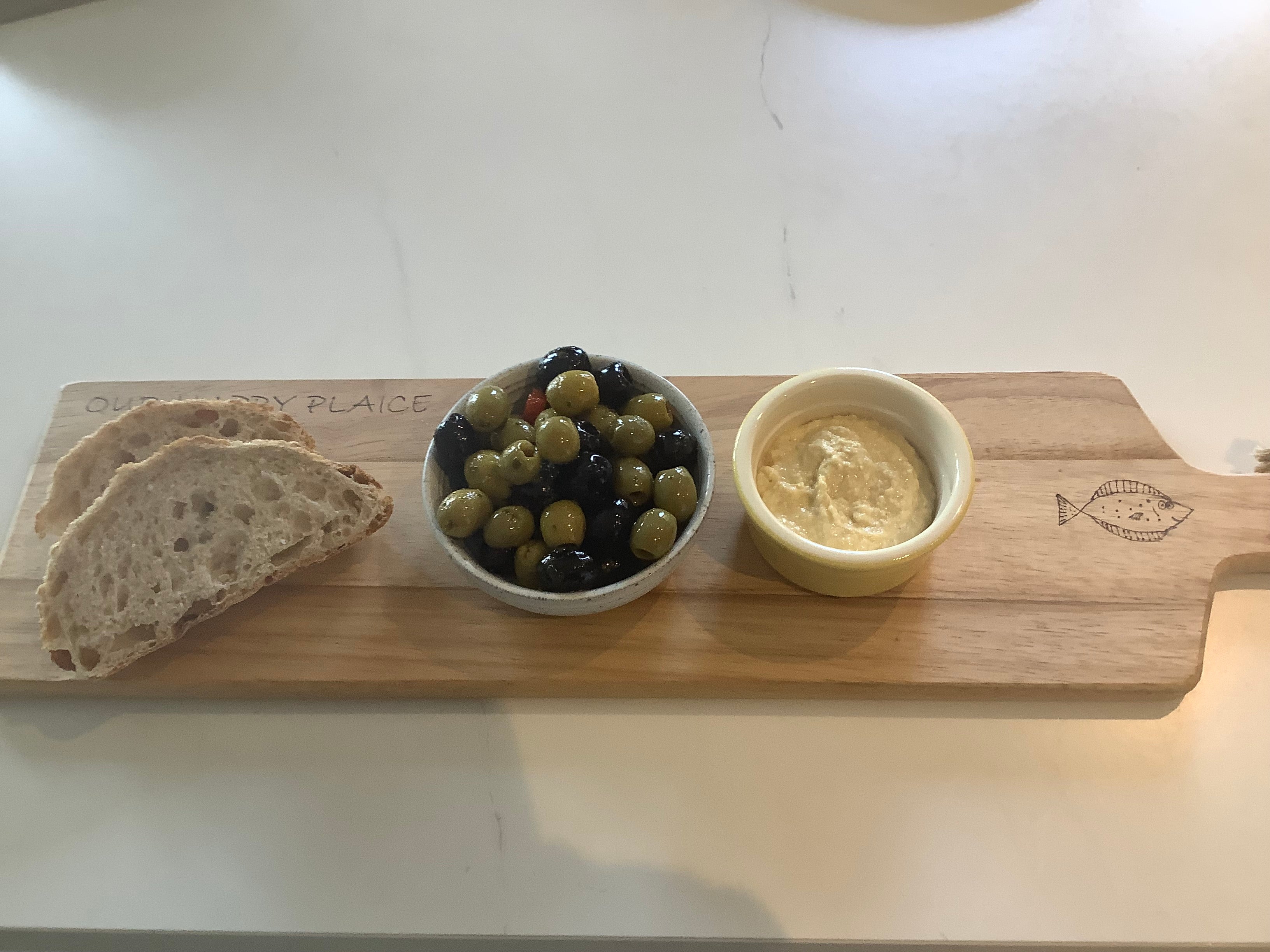 Hand-decorated Acacia wood serving board with Happy Plaice design